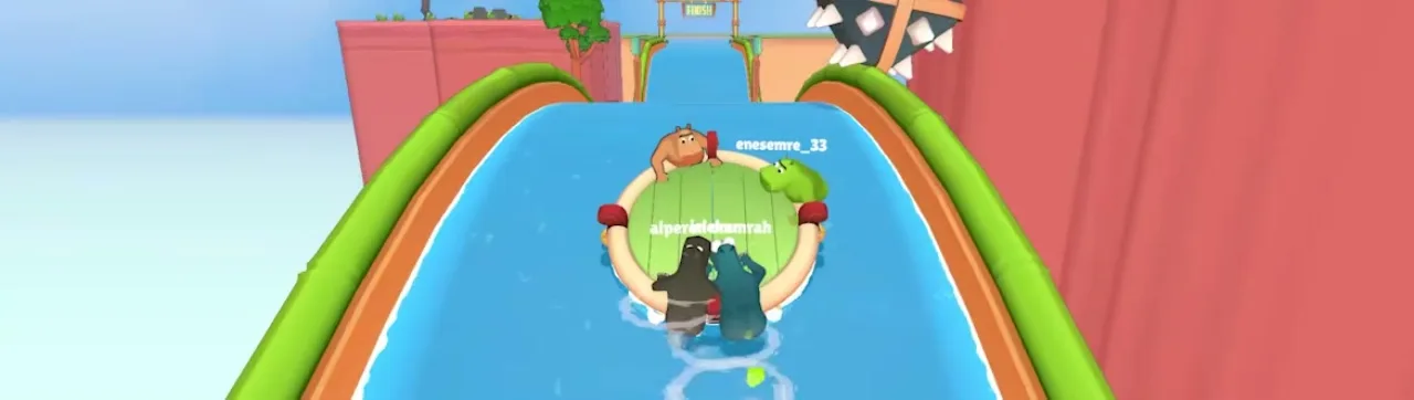 Four hippos on a round raft leave green gas trails on a slide channel with a FINISH banner and hanging spiked sphere ahead